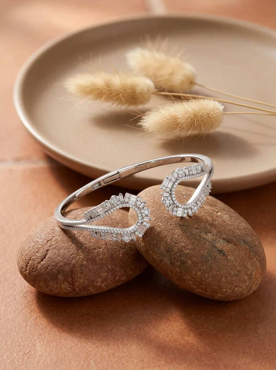 Studio AI flat-lay photoshoot of a paved cuff bracelet on stones, for a bracelet brand selling on marketplaces