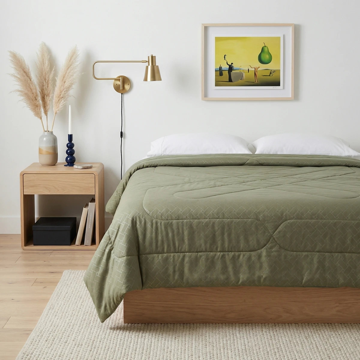 Sage green patterned comforter on a wooden bed in a bright modern bedroom.