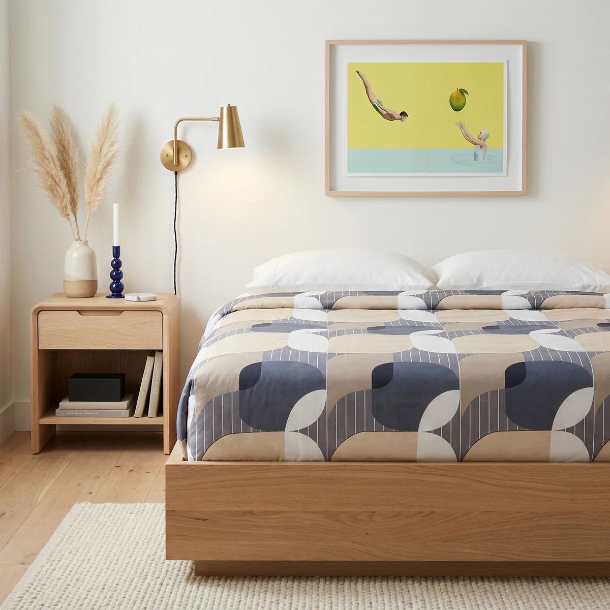 Kanika comforter with geometric blue and beige patterns on a modern wooden bed in a contemporary bedroom.