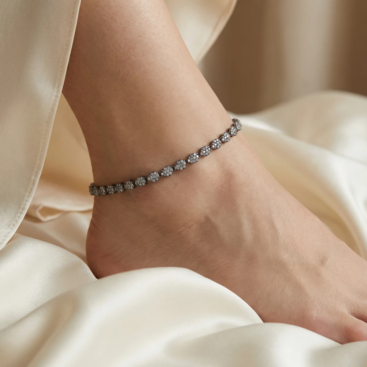 Studio AI photoshoot on a model of a diamond-encrusted anklet, for an anklets brand selling on marketplaces