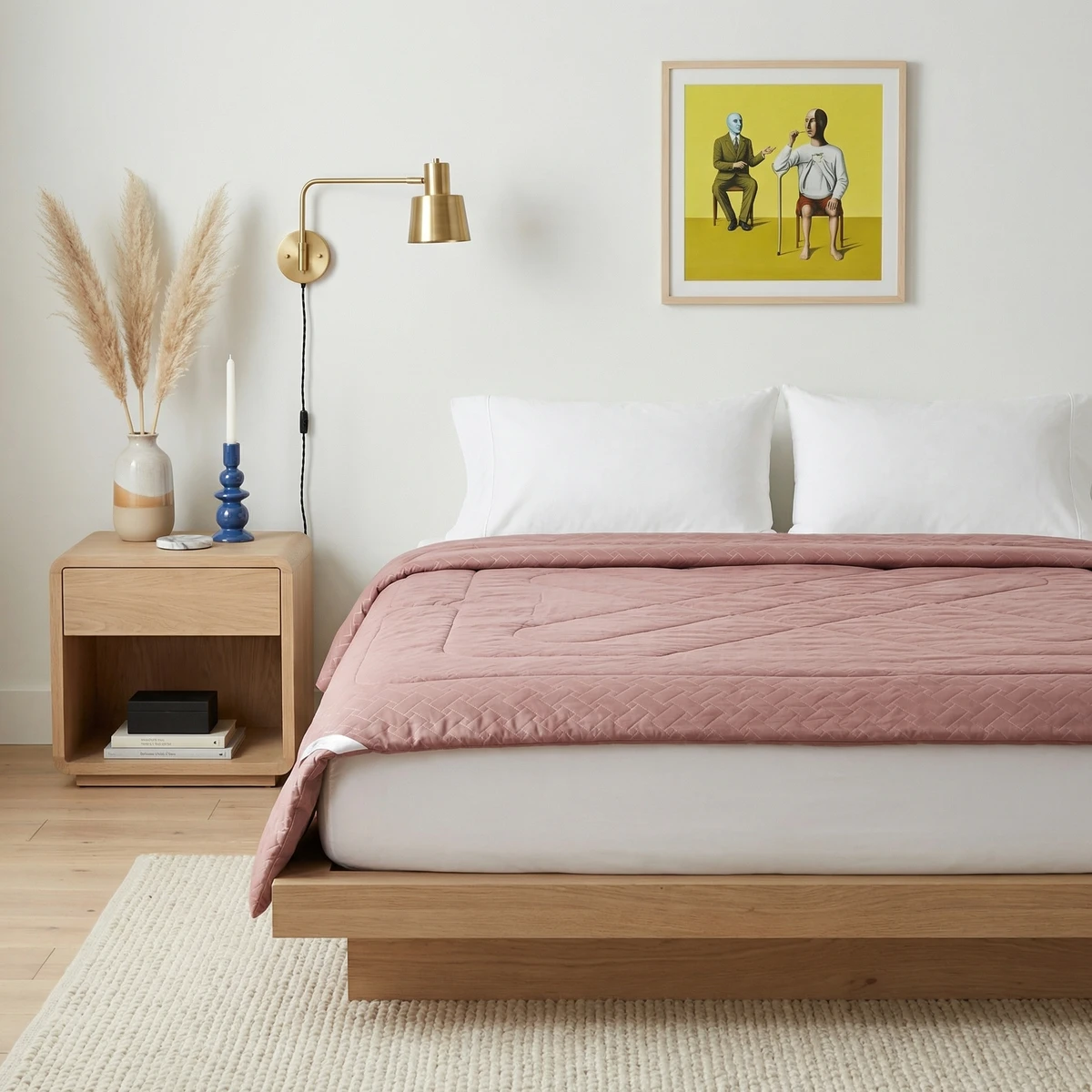 Mauve quilted comforter on a wooden platform bed with white pillows in a modern bedroom setting.