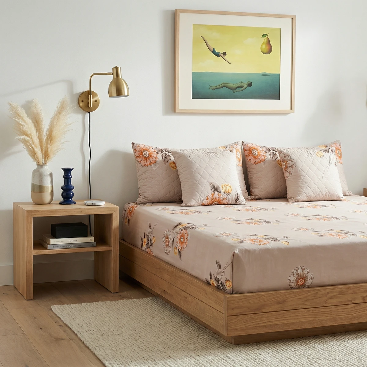 Kanika bed dressed in beige bed sheets featuring a printed floral pattern with matching quilted pillows.
