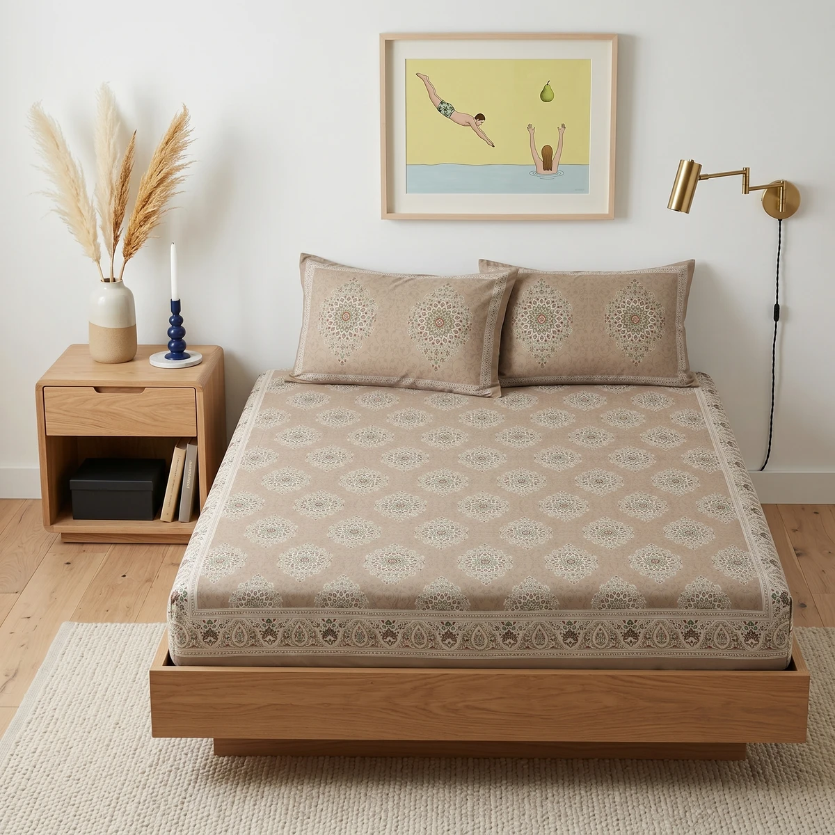Kanika bed sheet in beige with intricate medallion patterns and matching pillowcases on a wooden bed frame.